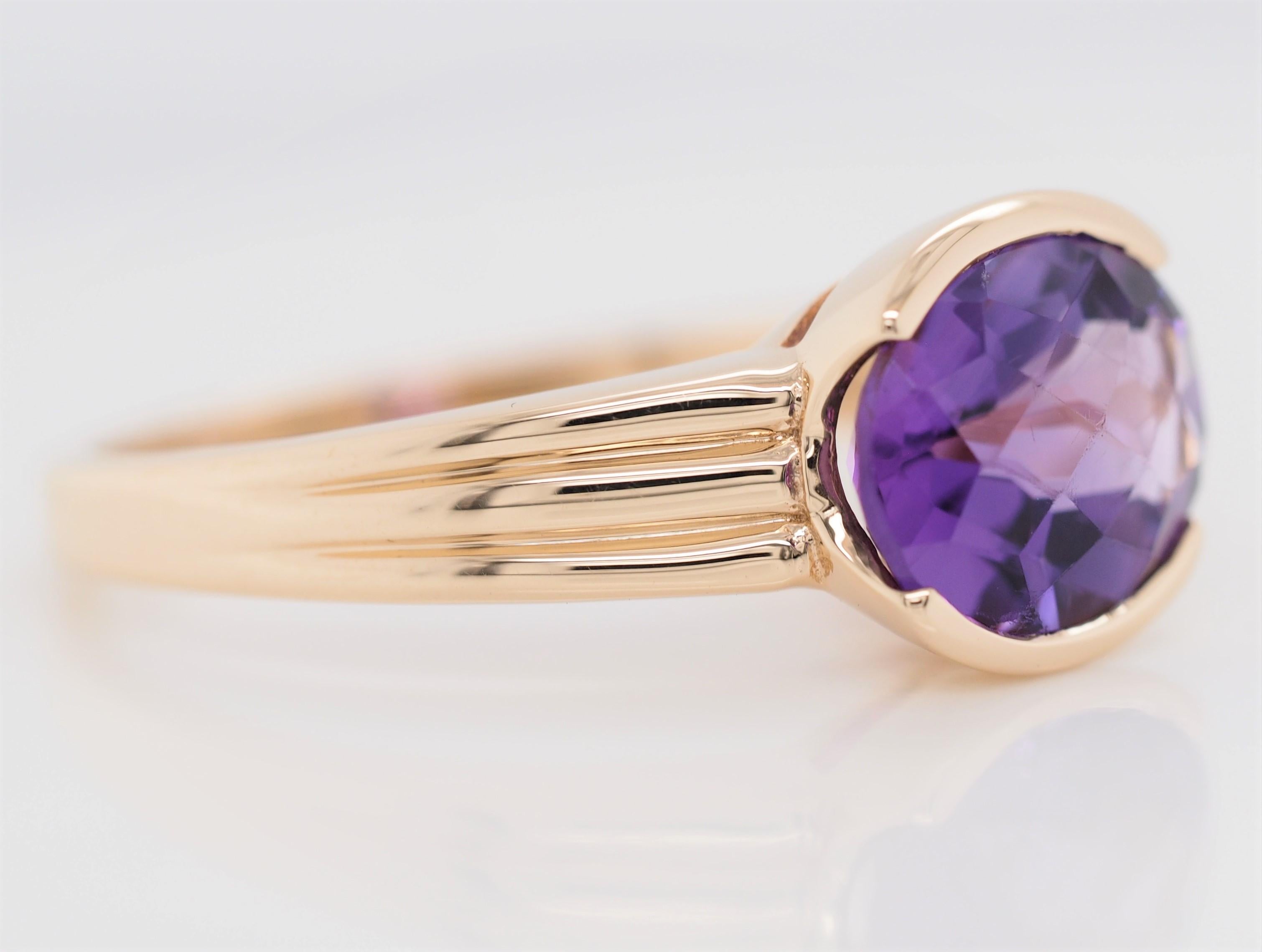 Oval Cut Amethyst 14 Karat Yellow Gold Fashion Ring In Excellent Condition For Sale In Addison, TX