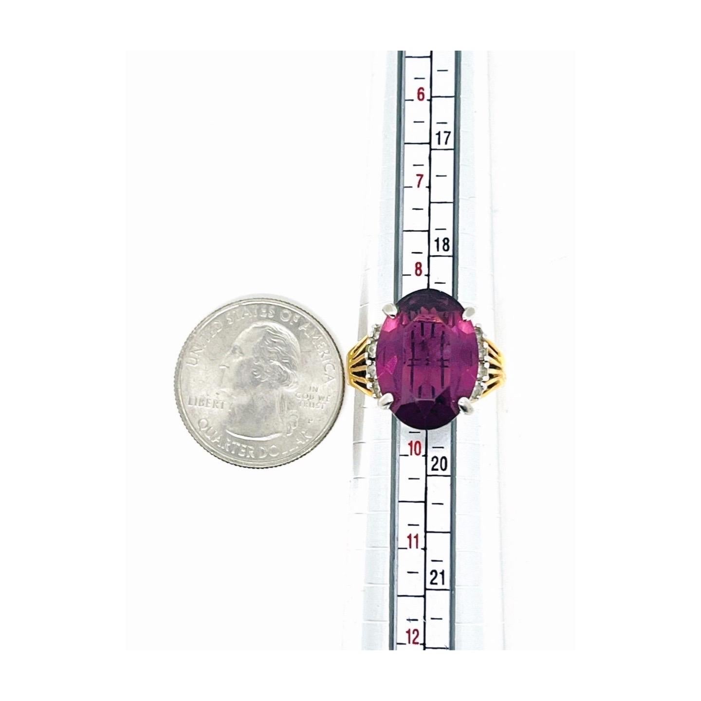 Oval-cut Amethyst, Clear Roundcut Rhinestone Cathedral Shank Ring, multi-split fan-shaped shoulder, open back basket setting, Silver-tone and gold-tone metal, Size 9, made in 1980s

Bold oval cut amethyst ring centered in between two rows of clear