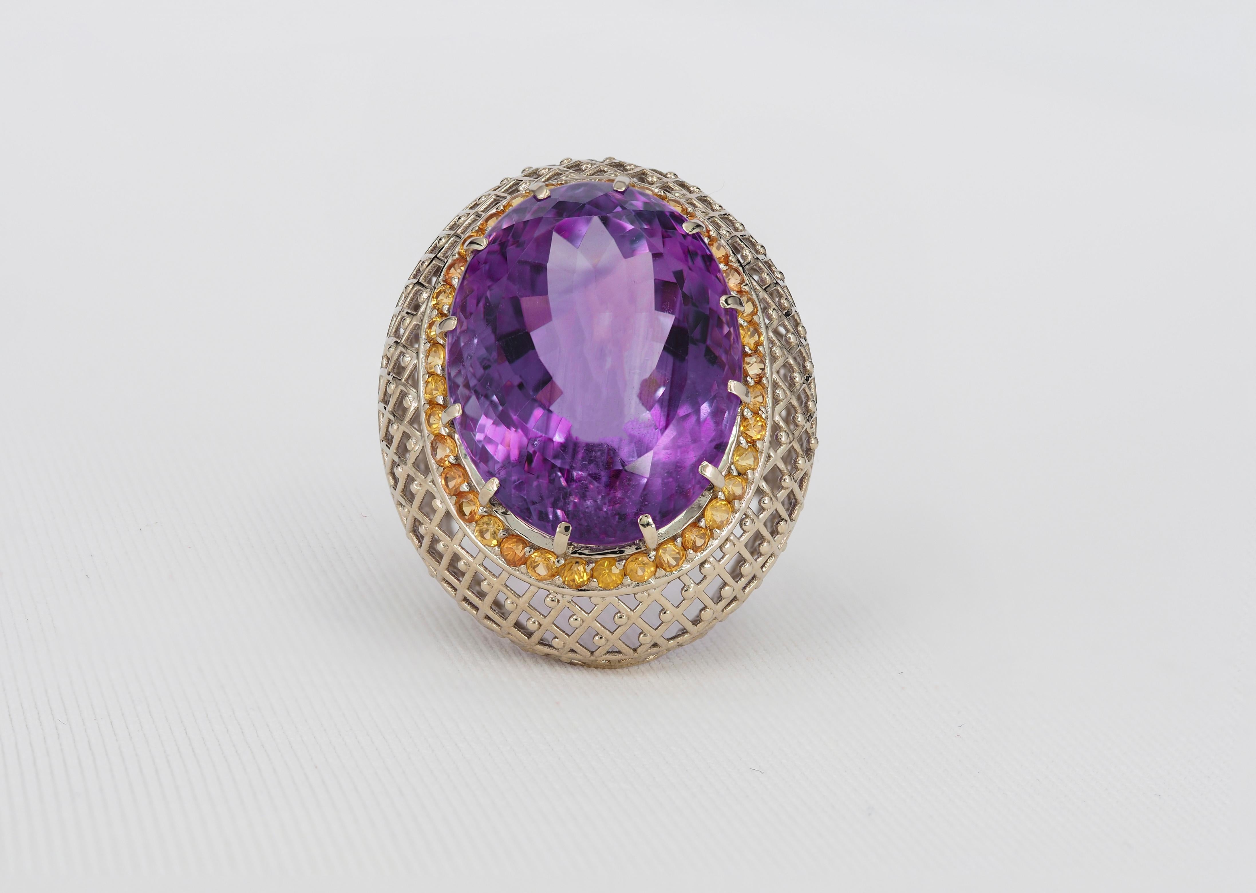 Oval cut amethyst cocktail ring with sapphires

Total weight 9.52 gr depends from size
14 k gold no hallmark (tested in lab)

Gemstones (all are tested by proffesional gemmologist)

Amethyst
1. Oval cut, -27 ct, transparent , purple-to violetcolor. 