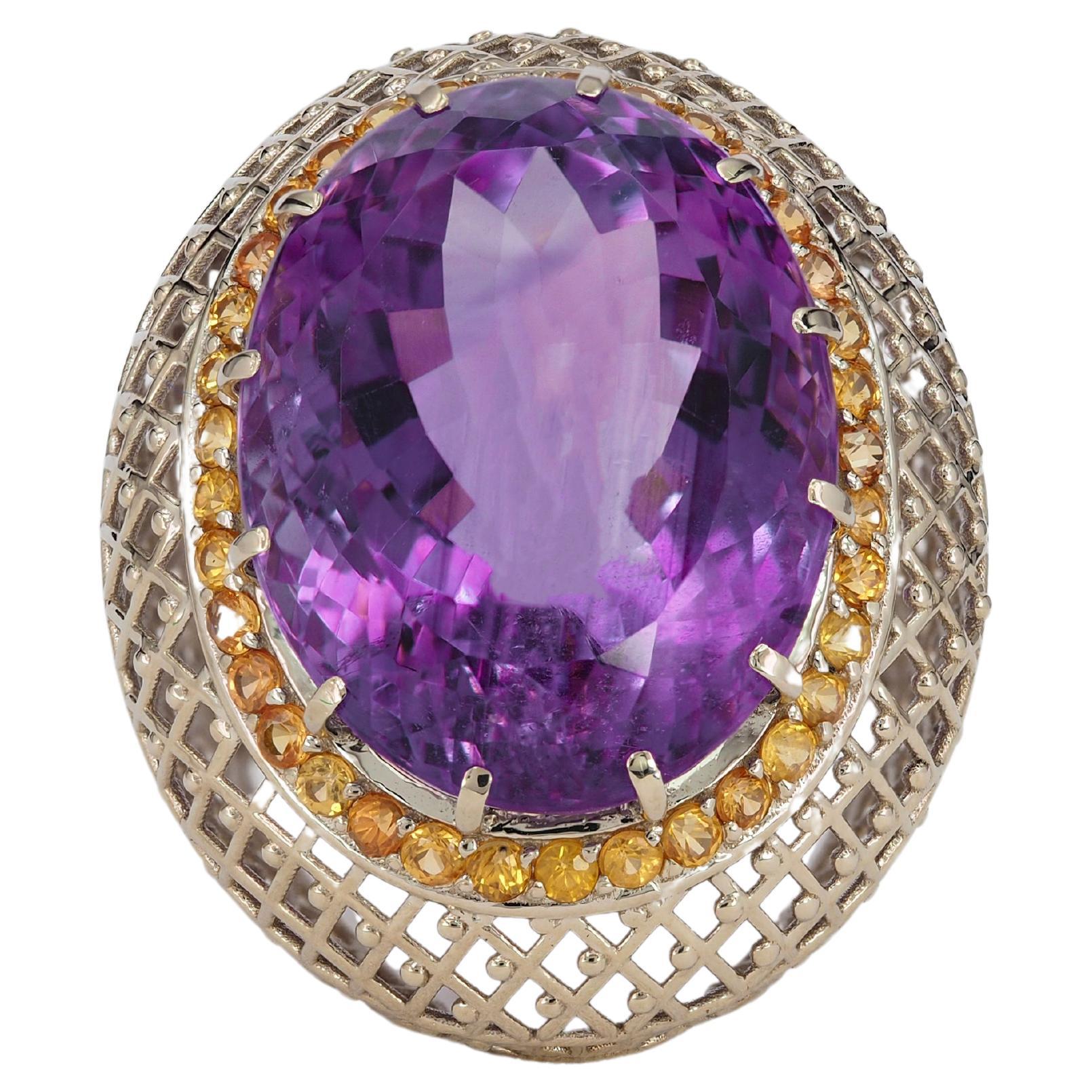 Oval cut amethyst cocktail ring with sapphires For Sale