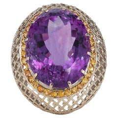 Oval cut amethyst cocktail ring with sapphires