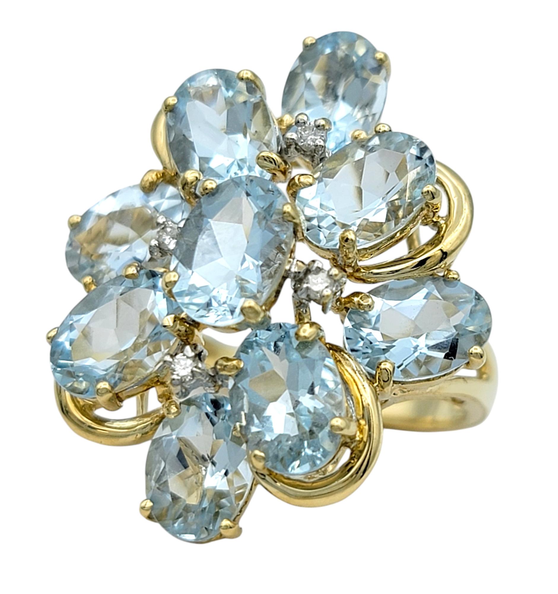Contemporary Oval Cut Aquamarine and Diamond Cluster Cocktail Ring in 14 Karat Yellow Gold For Sale