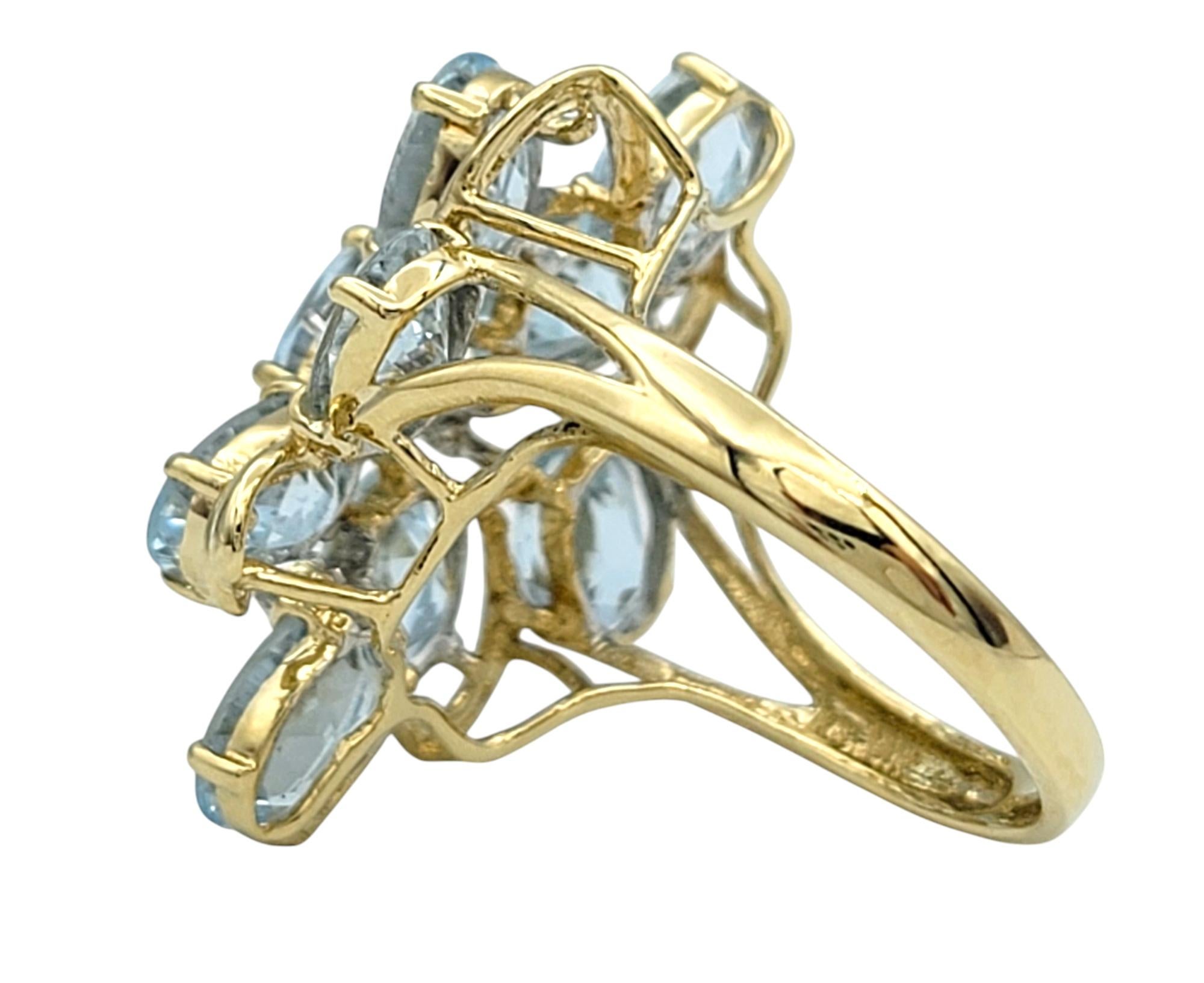 Women's Oval Cut Aquamarine and Diamond Cluster Cocktail Ring in 14 Karat Yellow Gold For Sale