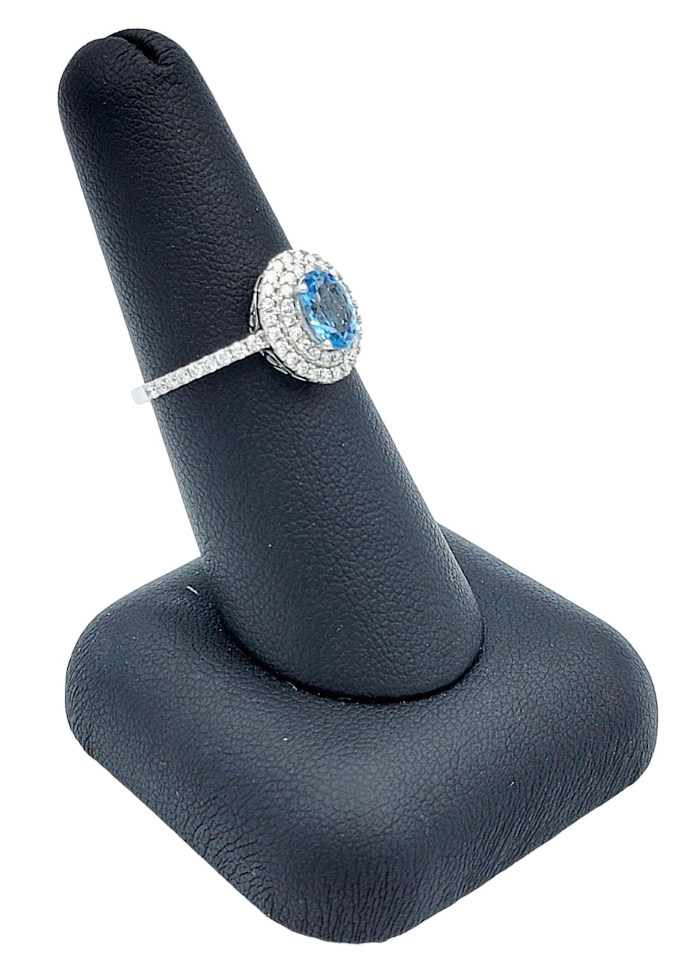 Oval Cut Aquamarine and Pavé Diamond Double Halo Ring Set in 18 Karat White Gold For Sale 5