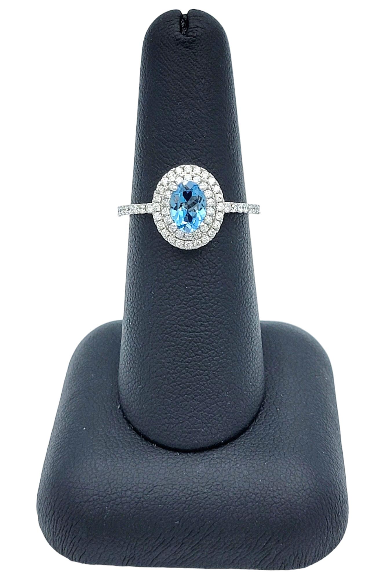 Oval Cut Aquamarine and Pavé Diamond Double Halo Ring Set in 18 Karat White Gold For Sale 4