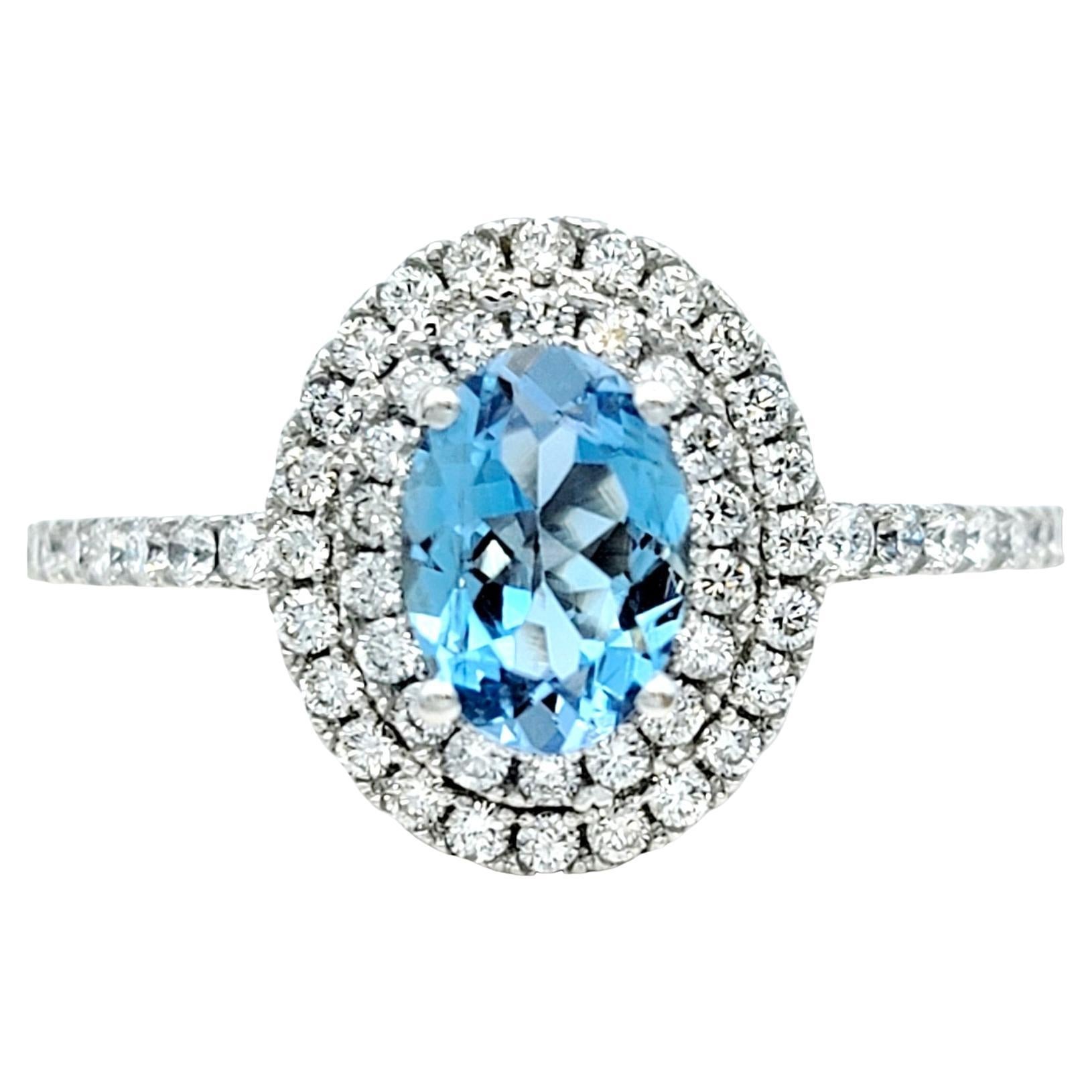 Oval Cut Aquamarine and Pavé Diamond Double Halo Ring Set in 18 Karat White Gold For Sale