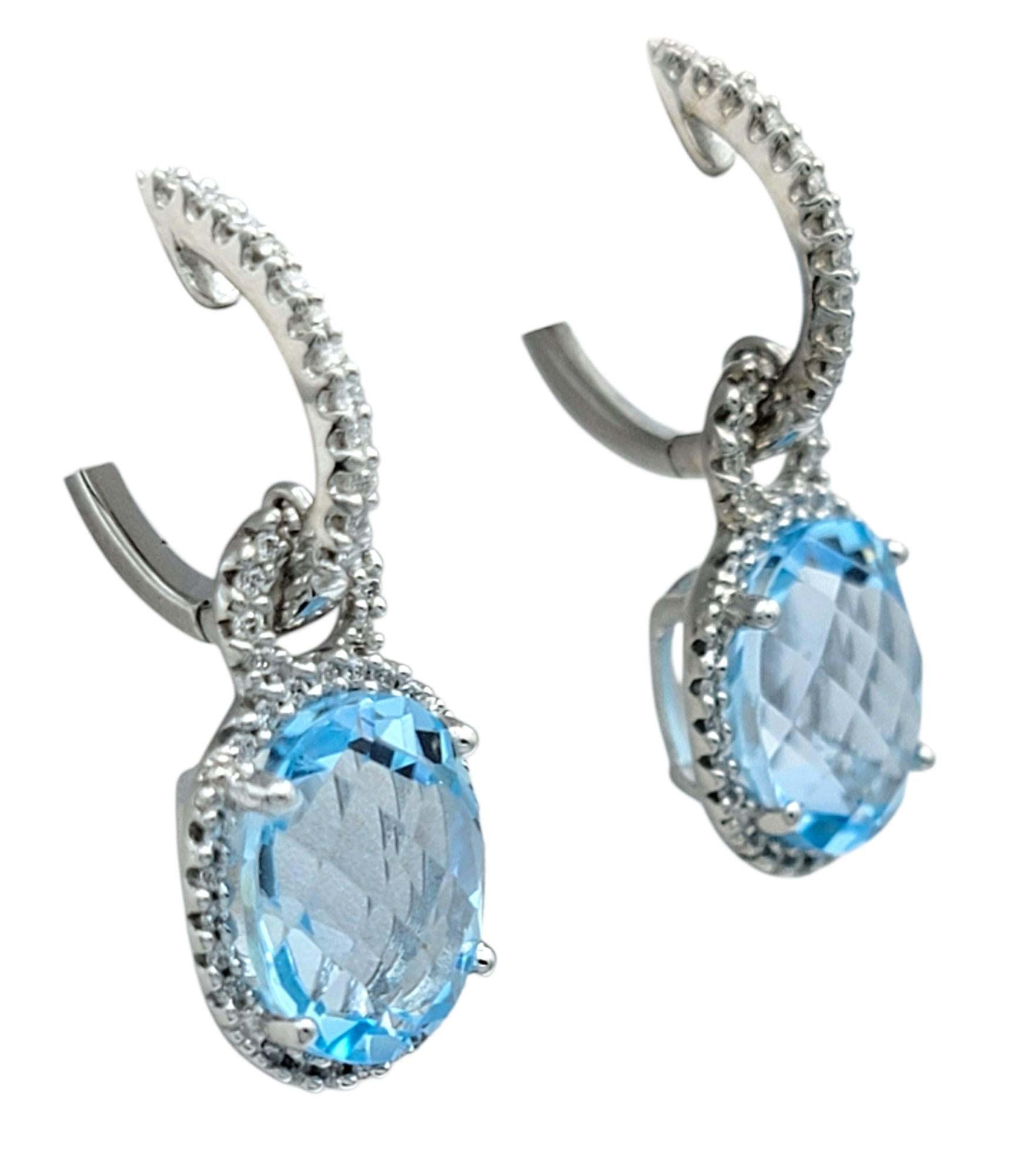 Contemporary Oval Cut Aquamarine and Pavé Diamond Halo Dangle Earrings in 18 Karat White Gold For Sale
