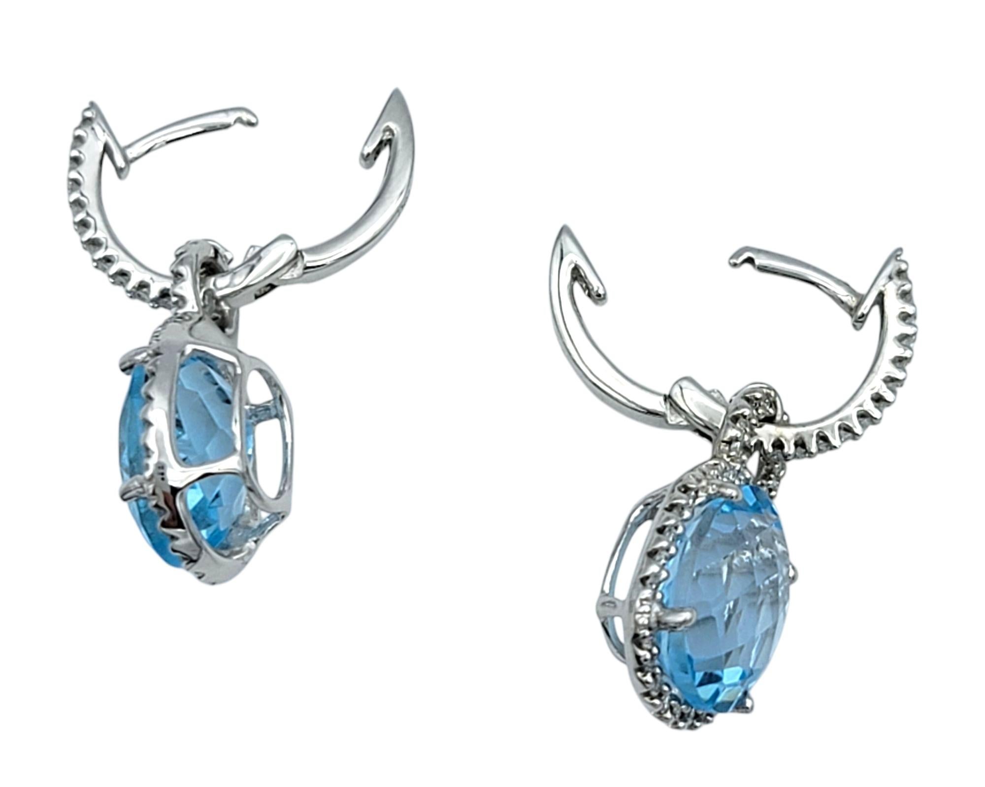 Women's Oval Cut Aquamarine and Pavé Diamond Halo Dangle Earrings in 18 Karat White Gold For Sale