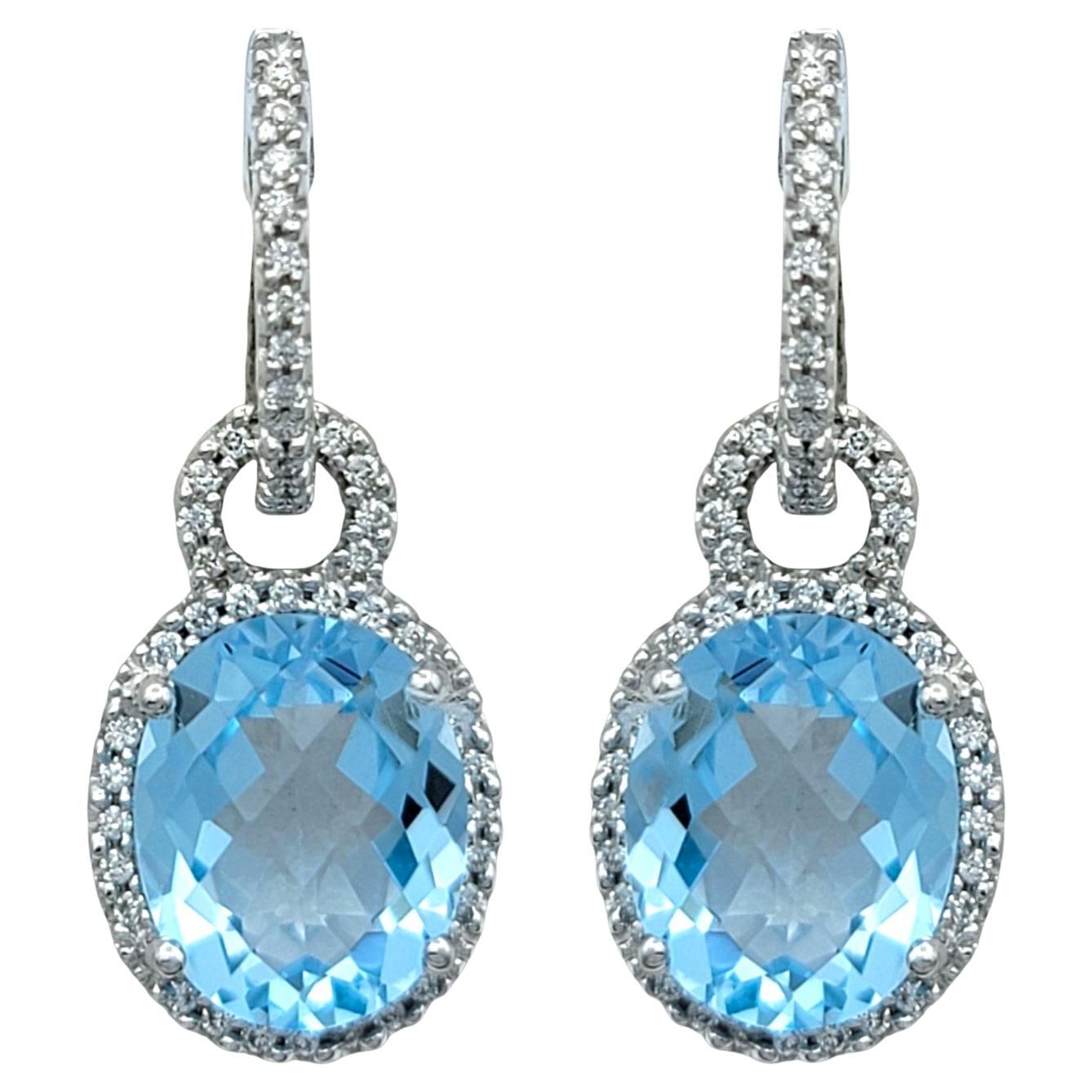 Oval Cut Aquamarine and Pavé Diamond Halo Dangle Earrings in 18 Karat White Gold
