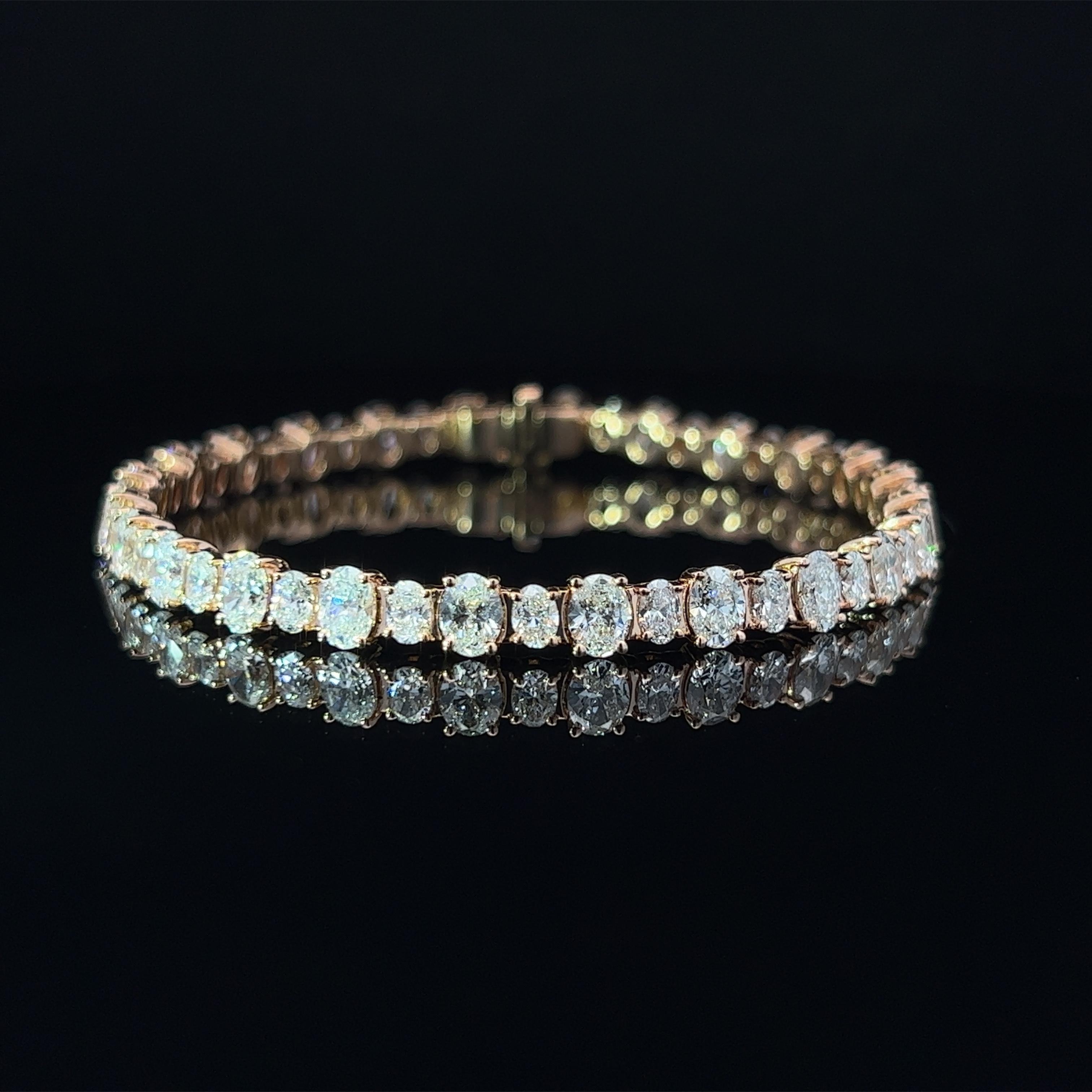 Diamond Shape: Oval Cut 
Total Diamond Weight: 10.57ct
Individual Diamond Weight: .33ct & .15ct
Color/Clarity: GH VVS  
Metal: 18K Rose Gold  
Metal Weight: 16.52g 

Key Features:

Oval-Cut Diamonds: The centerpiece of this bracelet showcases a