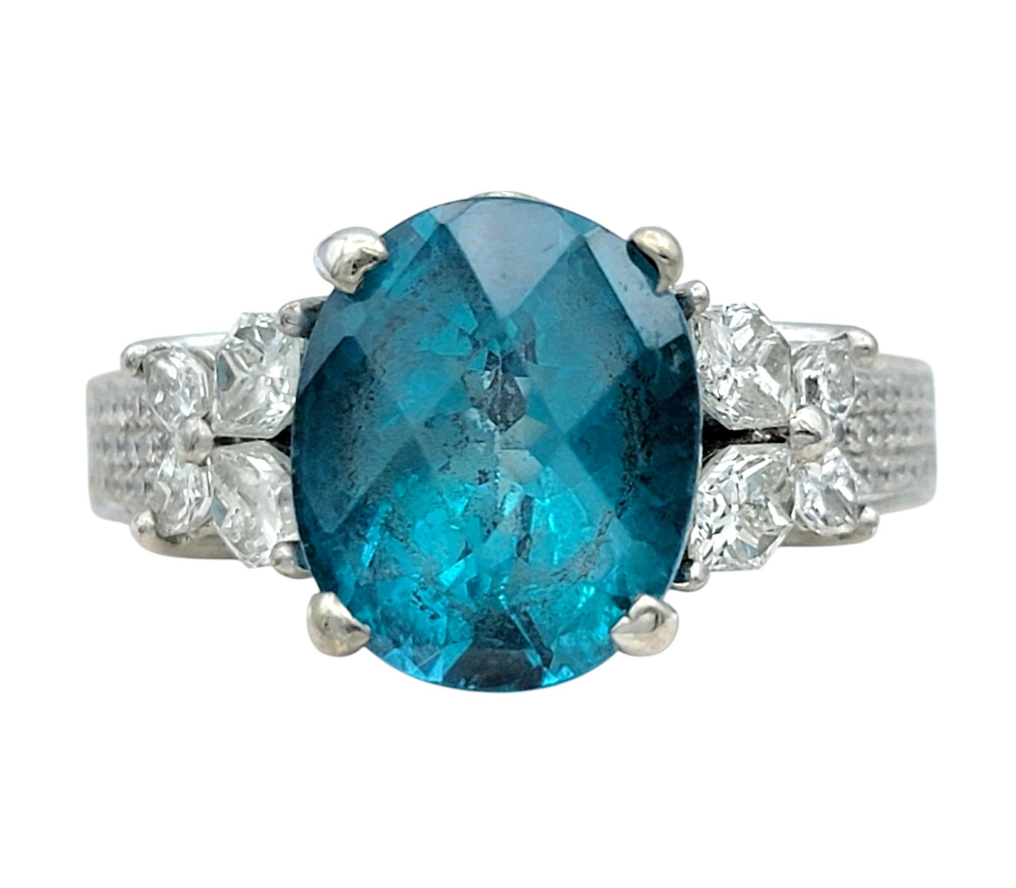 Ring Size: 6.5 

Immerse yourself in the captivating beauty of this blue apatite and diamond ring, a masterpiece of elegance and sophistication. The vibrant blue apatite takes center stage, its oval cut showcasing mesmerizing hues reminiscent of