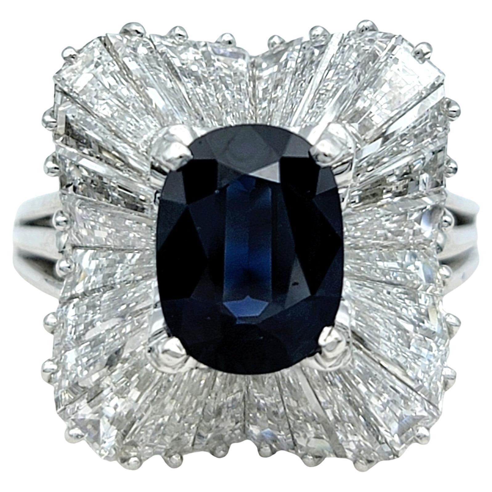 Oval Cut Blue Sapphire and Baguette Diamond Ballerina Style Ring in Platinum