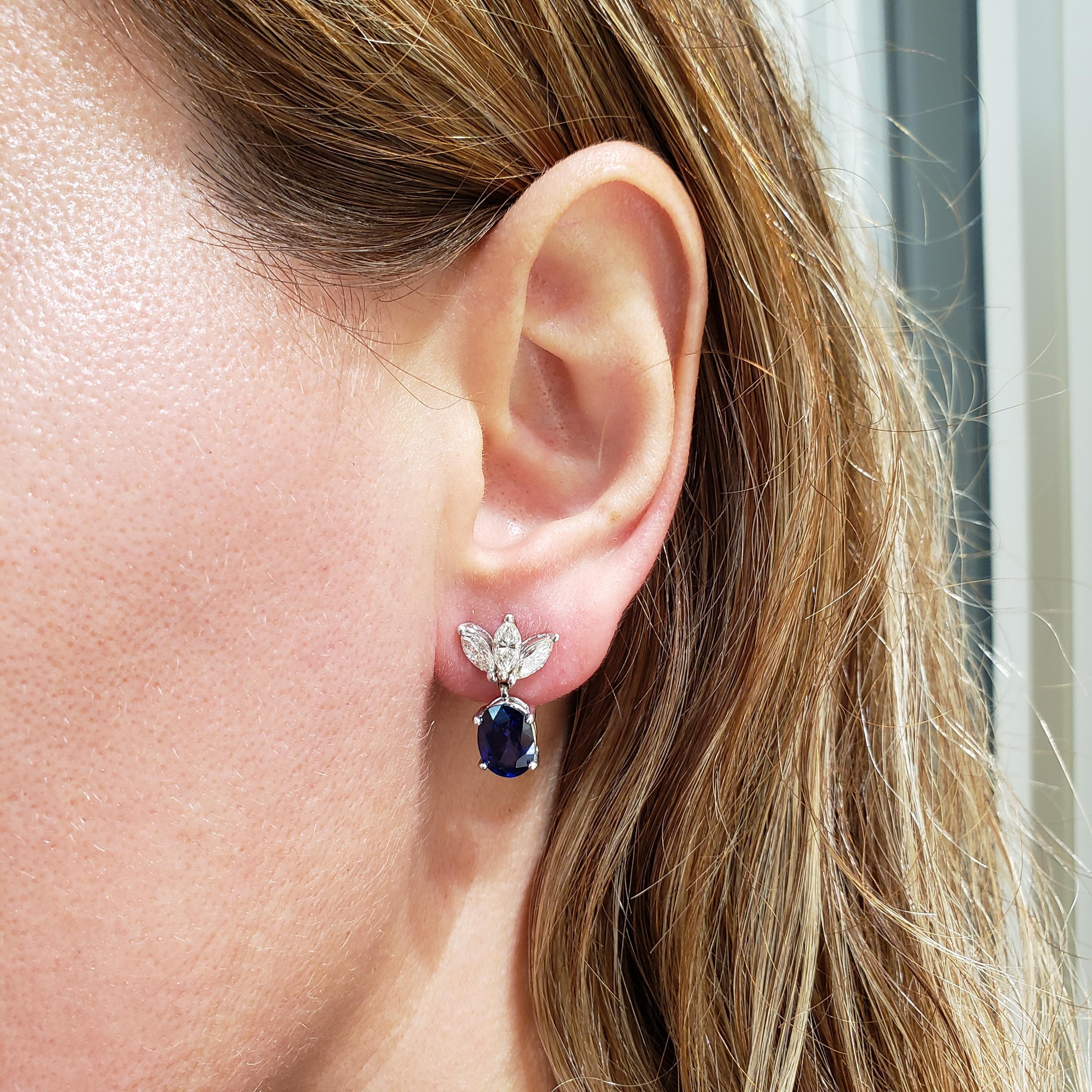 Each earring features a color-rich blue sapphire, suspended on three marquise cut diamonds. Set in 14 karat white gold. Sapphires weigh 4.00 carats total; diamonds weigh 0.91 carats total.

Style available in different price ranges. Prices are based