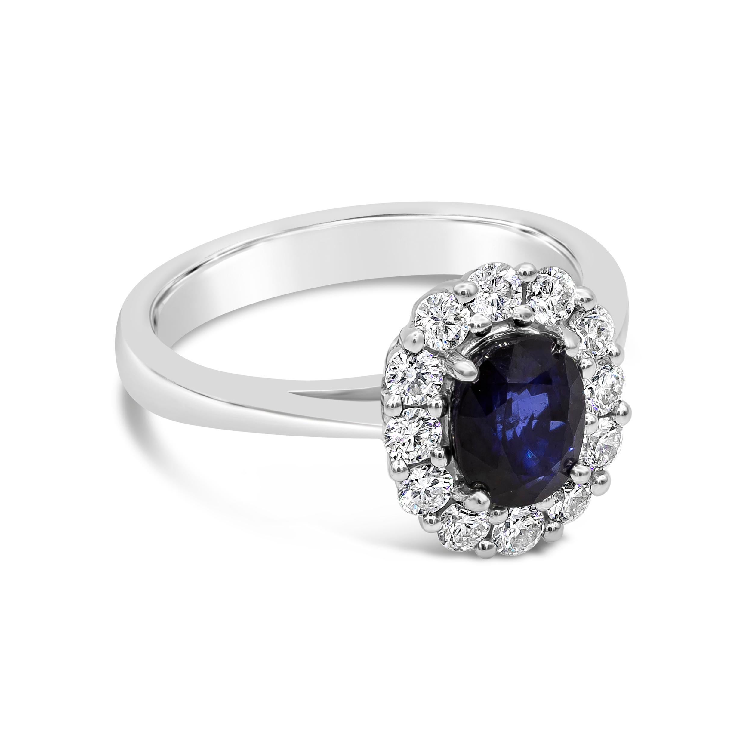 An elegant and classic engagement ring showcasing a 1.60 carat oval cut blue sapphire, surrounded by a single row of 12 round brilliant diamonds weighing 0.54 carats total. Finely made in 18k White Gold. Size 6.5 US resizable upon request.

Roman