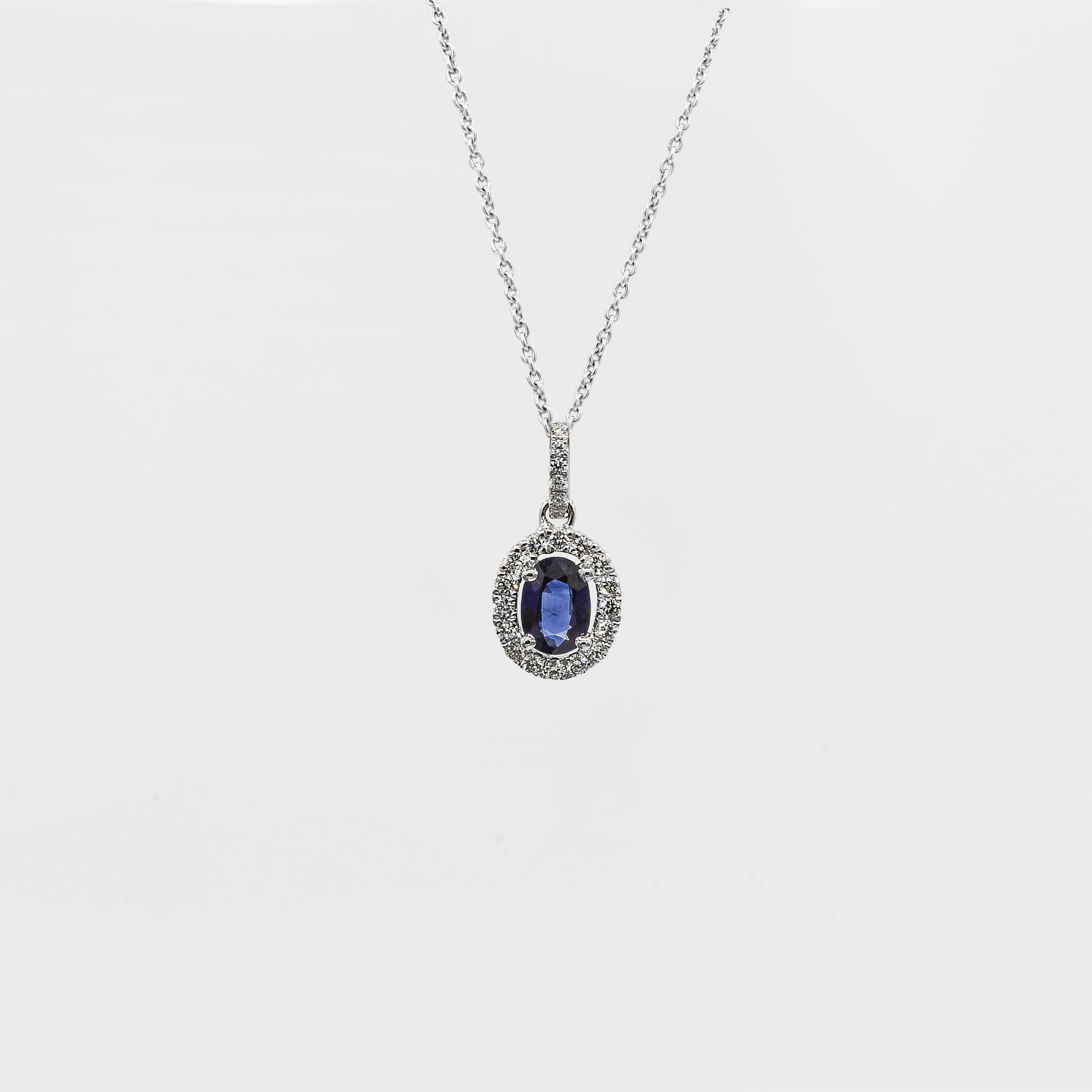 Showcasing a 0.69 carat oval cut blue sapphire, set in a floating halo of round brilliant diamonds weighing 0.27 carats total. Suspended on a diamond encrusted bale in an 16 inch white gold chain 

Style available in different price ranges. Prices