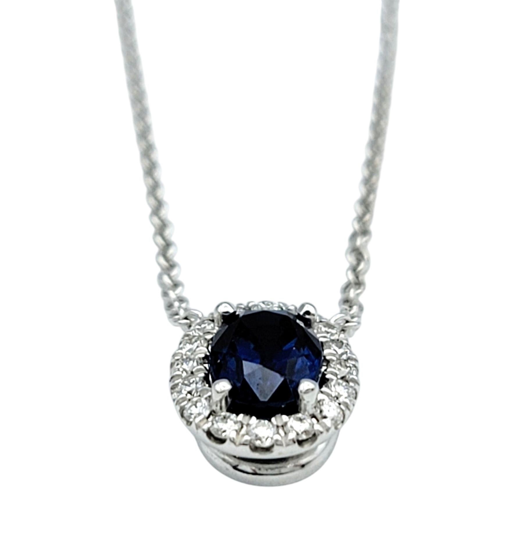 Oval Cut Blue Sapphire and Diamond Halo Pendant Necklace in 18 Karat White Gold In Good Condition For Sale In Scottsdale, AZ