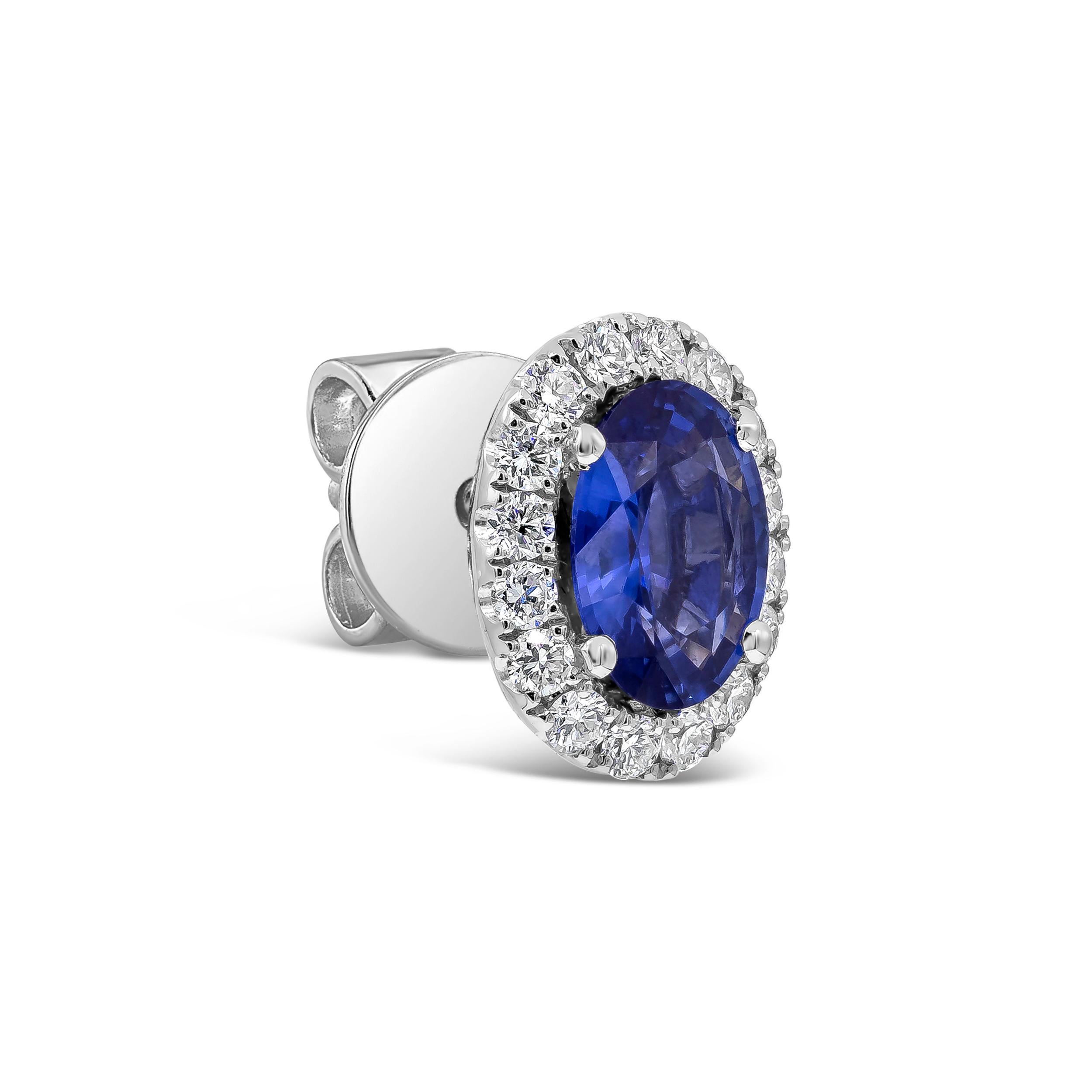 Showcasing two color-rich oval cut blue sapphires weighing 1.64 carats total, surrounded by a single row of round brilliant diamonds. Accent diamonds weigh 0.40 carats total. Made in 18K White Gold

Style available in different price ranges. Prices
