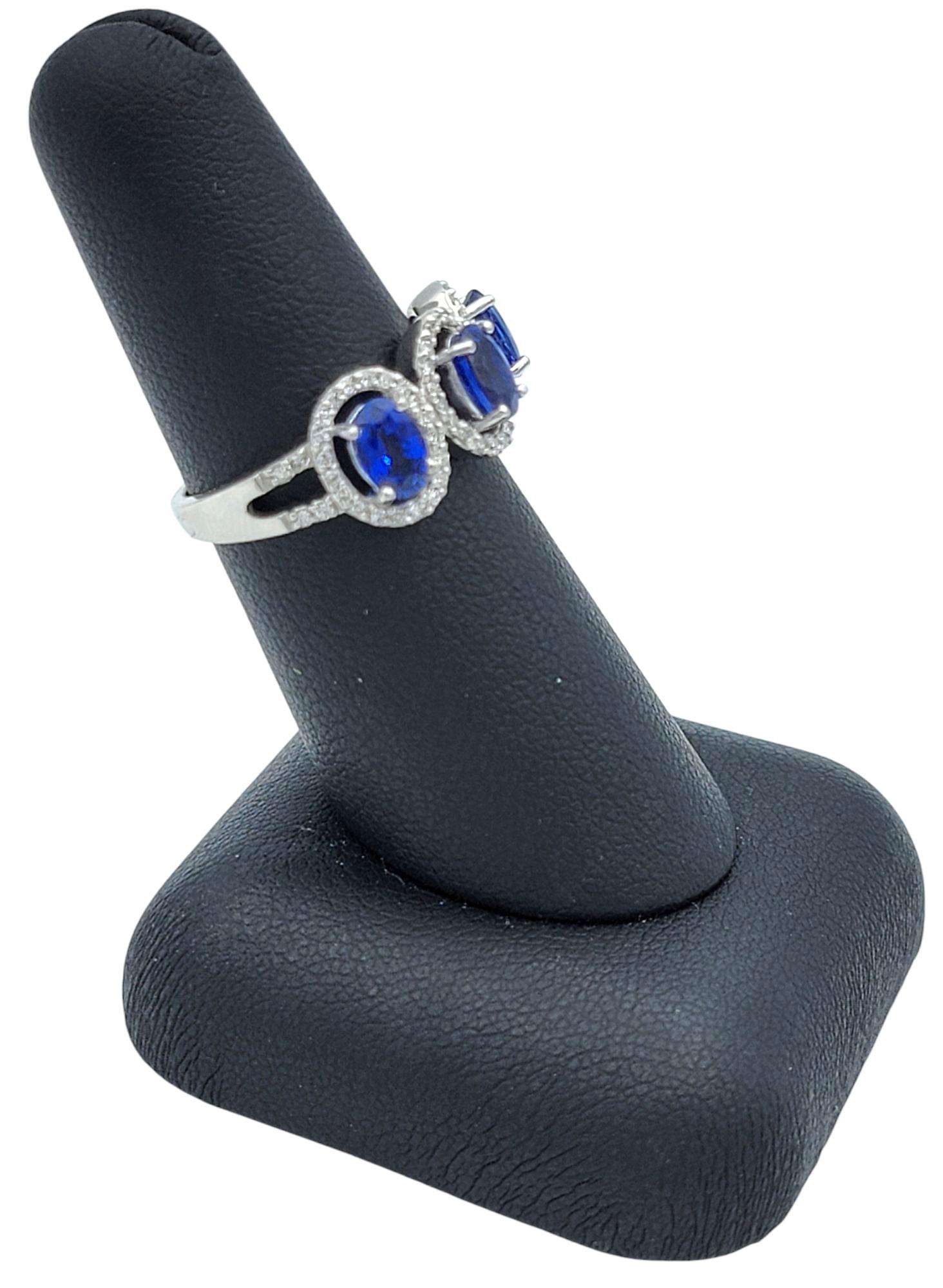 Oval Cut Blue Sapphire and Diamond Halo Three Stone Ring in 18 Karat White Gold For Sale 8