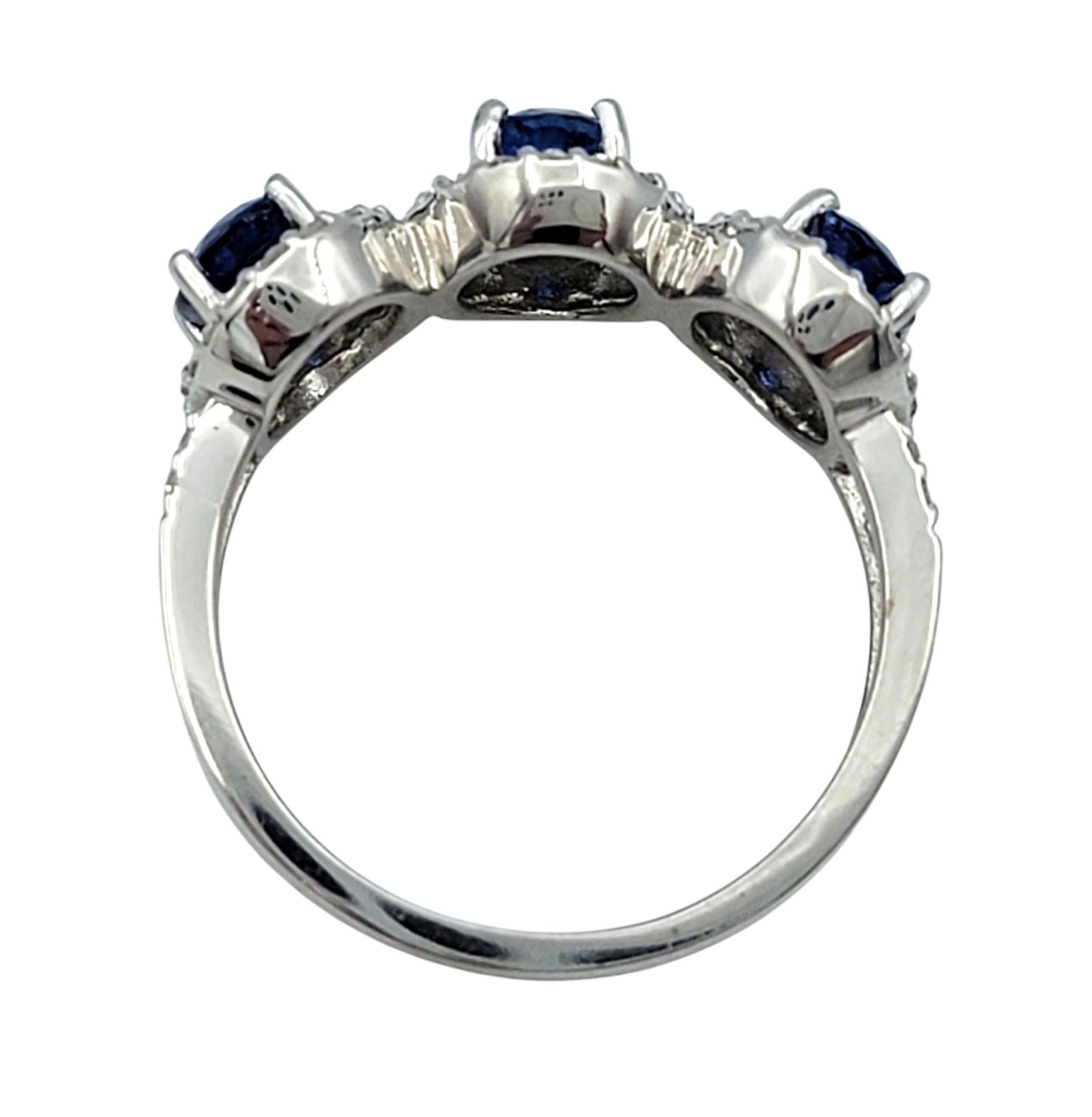 Oval Cut Blue Sapphire and Diamond Halo Three Stone Ring in 18 Karat White Gold For Sale 3