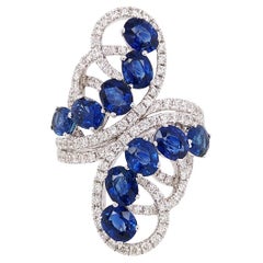Oval cut Blue Sapphire and Round cut white diamonds, 18K Gold Cocktail Ring