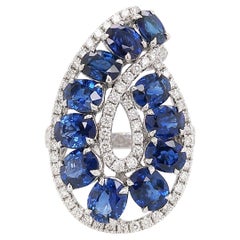Oval cut Blue Sapphire and Round cut white diamonds, 18K Gold Cocktail Ring