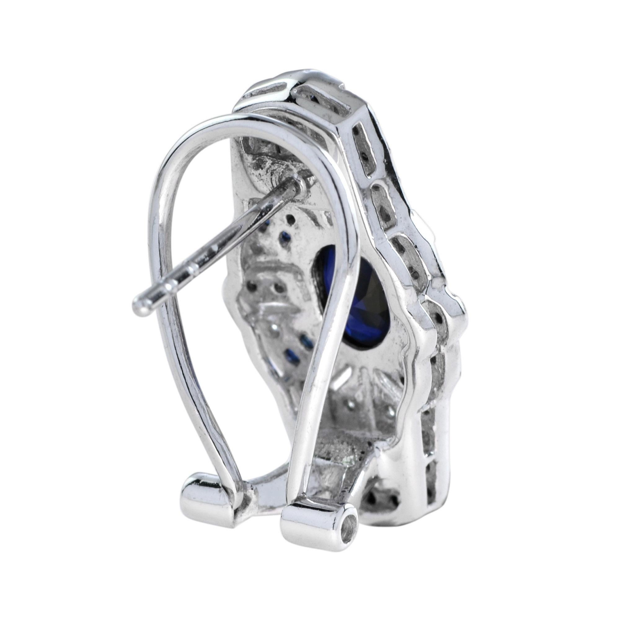 Pair of Art Deco design with sapphire and diamond earrings, each of shield-shaped, millegrain set with round diamonds and French cut sapphire surround the natural oval sapphire. 14K White Gold. 
Information
Width: 12 mm.
Length: 22 mm.
Weight: 8.20