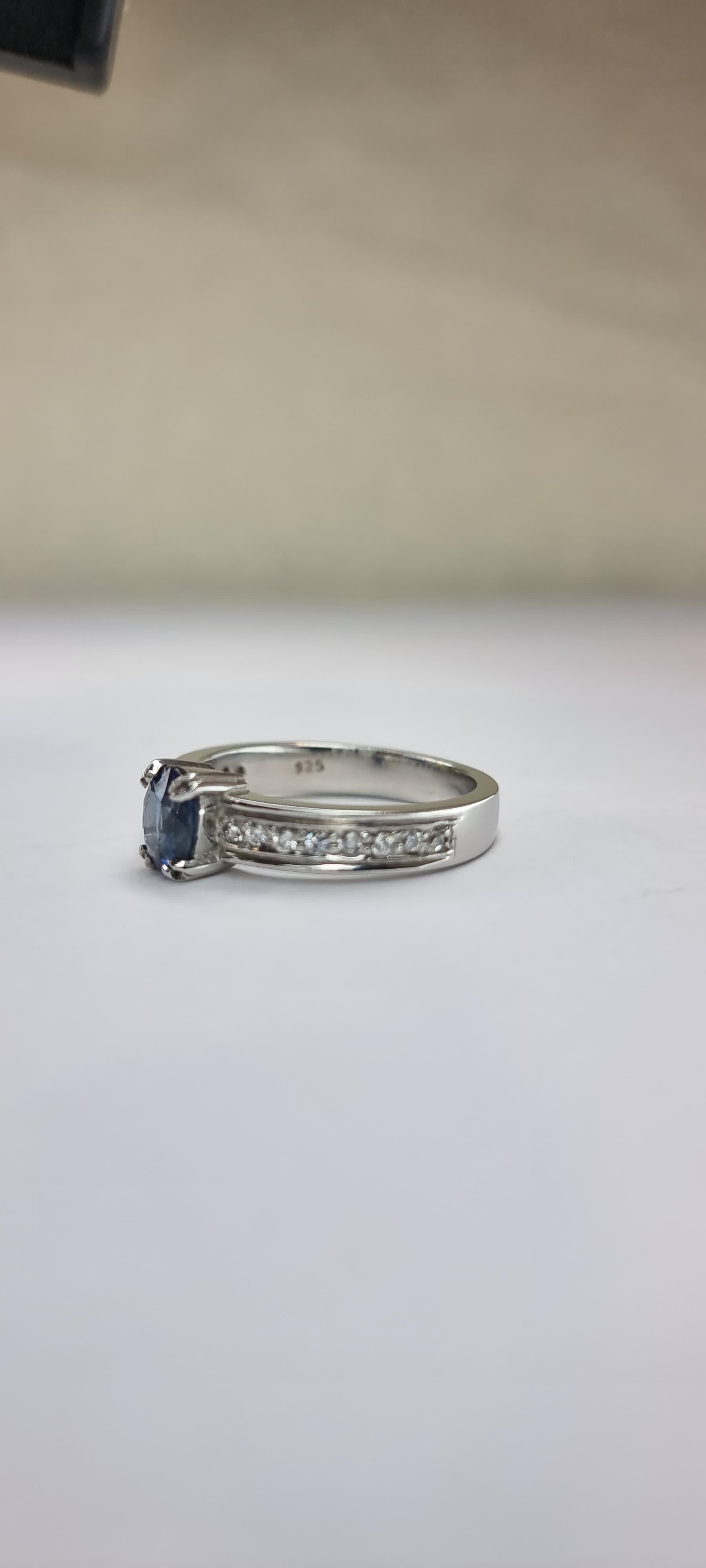 Oval-Cut Blue Sapphire Engagement Ring with Natural Zircon Accents For Sale 9