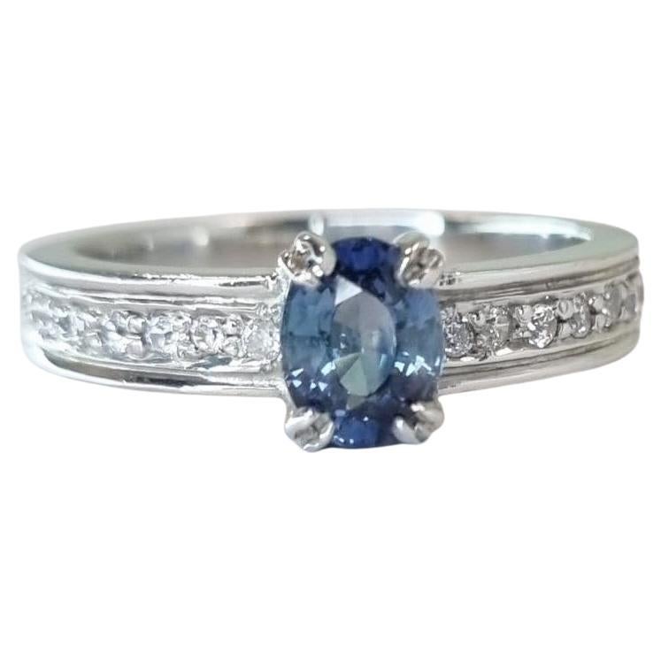 1ct Oval-Cut Blue Sapphire Engagement Ring with Zircon Accents in Platinum-Coated Sterling Silver
Product Description

Discover the elegance of this 1ct blue sapphire engagement ring, designed to captivate with its vibrant beauty and expert