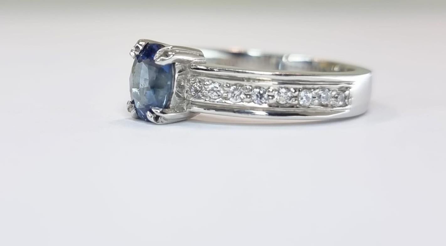 Modern Oval-Cut Blue Sapphire Engagement Ring with Natural Zircon Accents For Sale