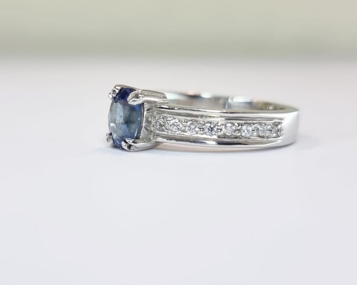 Oval-Cut Blue Sapphire Engagement Ring with Natural Zircon Accents For Sale 1