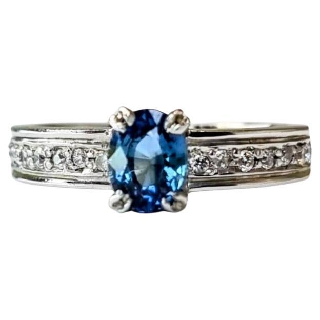 Oval-Cut Blue Sapphire Engagement Ring with Natural Zircon Accents