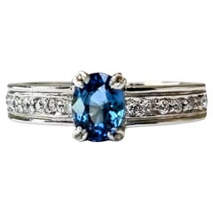 Oval-Cut Blue Sapphire Engagement Ring with Natural Zircon Accents