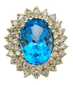 Oval Cut Blue Topaz and Double Diamond Halo Cocktail Ring 14 Karat Yellow Gold