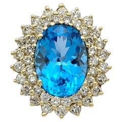 Oval Cut Blue Topaz and Double Diamond Halo Cocktail Ring 14 Karat Yellow Gold