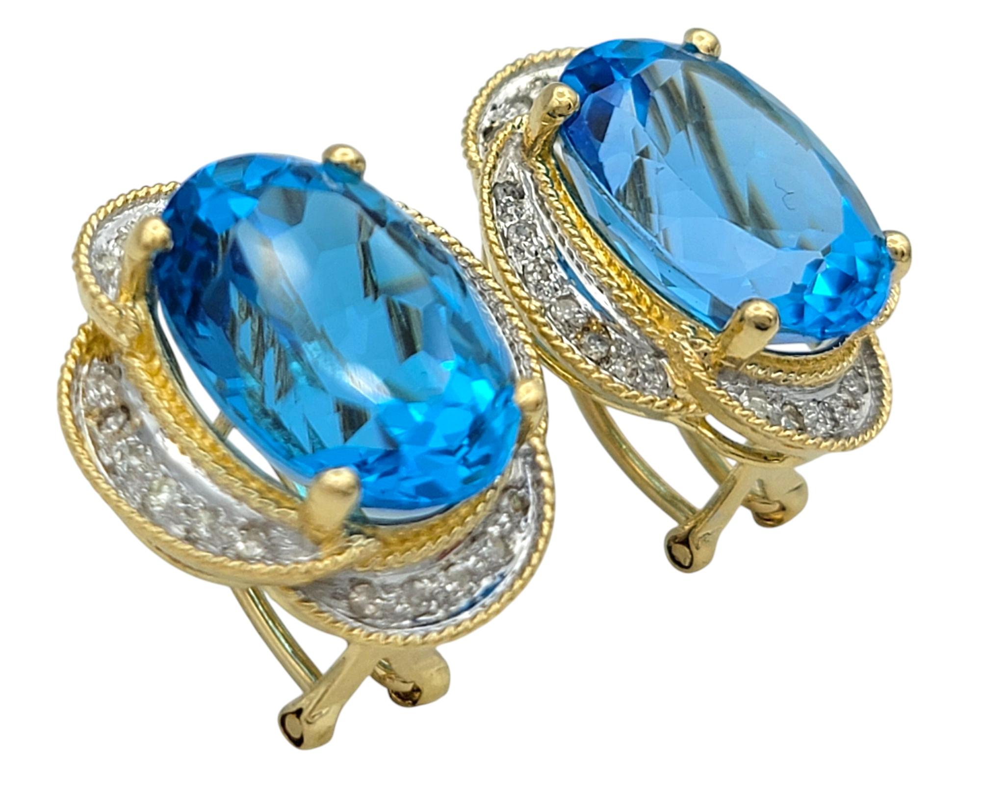 Contemporary Oval Cut Blue Topaz and Pavé Diamond Omega Back Earrings Two-Tone 14 Karat Gold For Sale