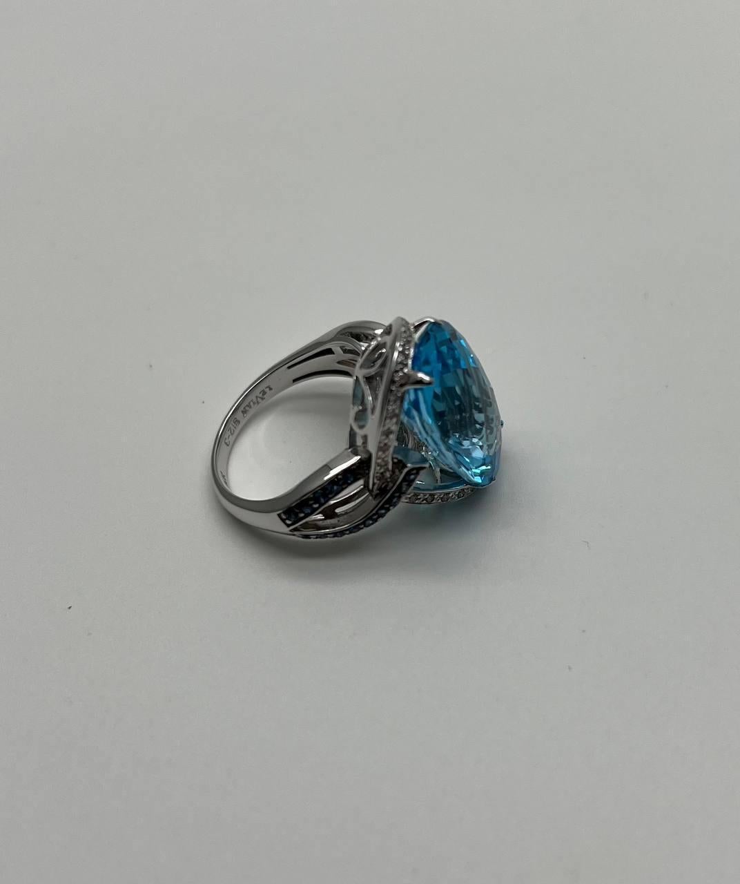 Oval Cut Blue Topaz Intertwining Sapphire Diamond Halo White Gold Statement Ring For Sale 6