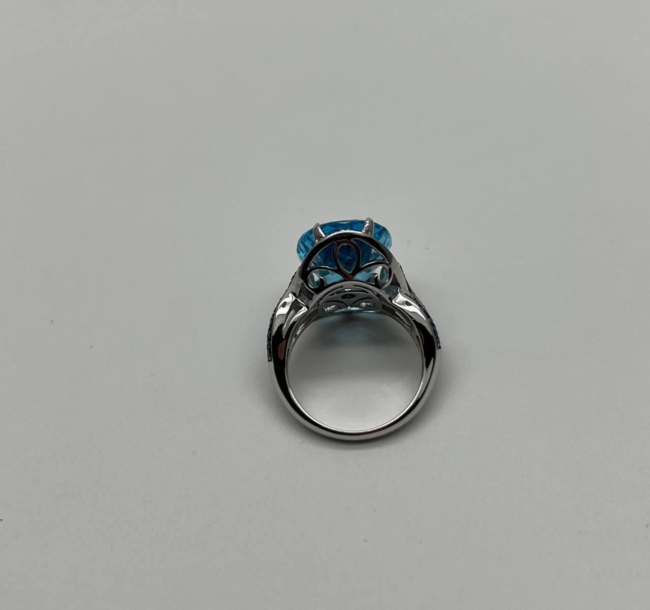 Oval Cut Blue Topaz Intertwining Sapphire Diamond Halo White Gold Statement Ring For Sale 7