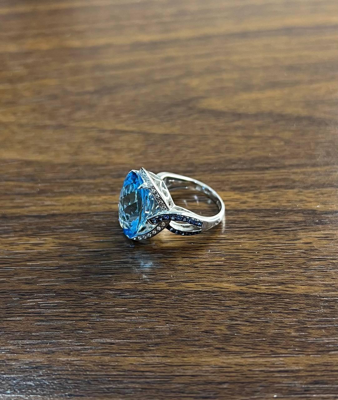 Women's Oval Cut Blue Topaz Intertwining Sapphire Diamond Halo White Gold Statement Ring For Sale