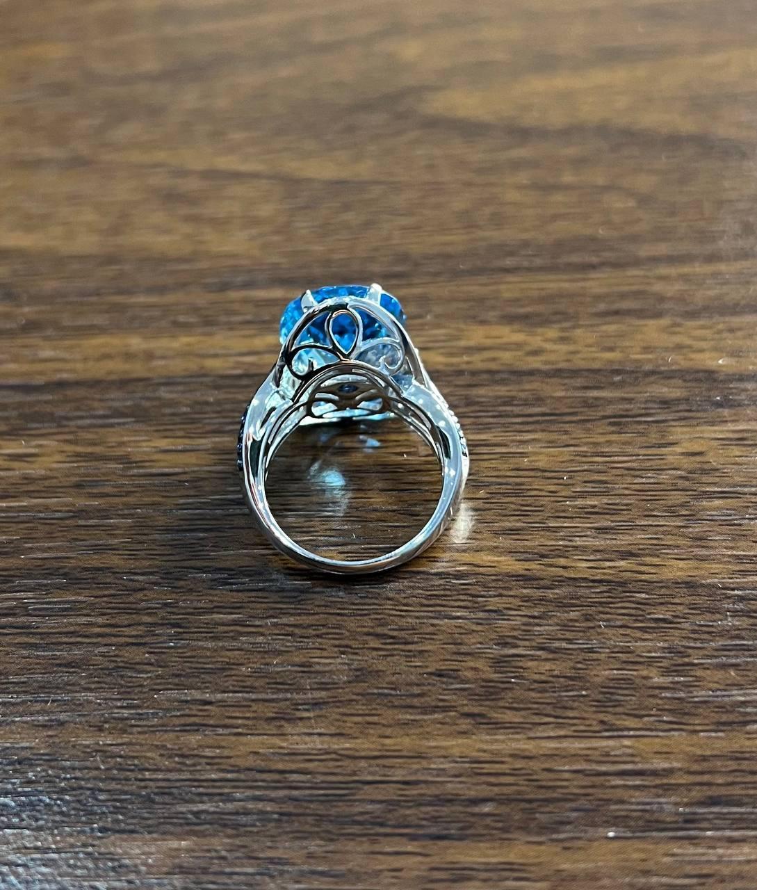 Oval Cut Blue Topaz Intertwining Sapphire Diamond Halo White Gold Statement Ring For Sale 1