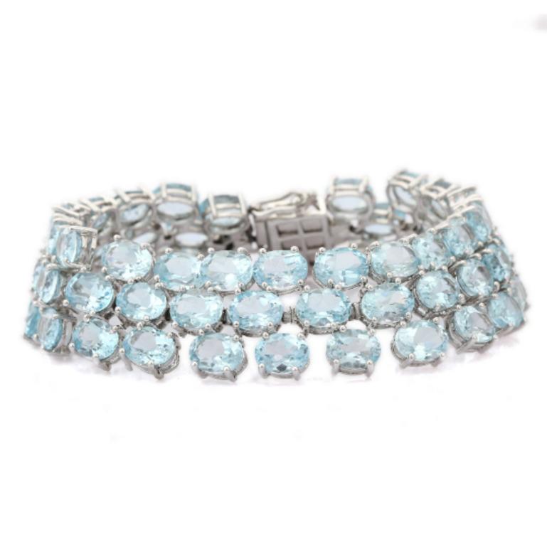 Contemporary Three Row Blue Topaz Statement Tennis Bracelet in 925 Sterling Silver For Sale