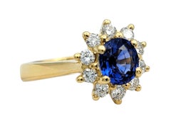 Oval Cut Ceylon Sapphire and Diamond Halo Ring in Polished 18 Karat Yellow Gold