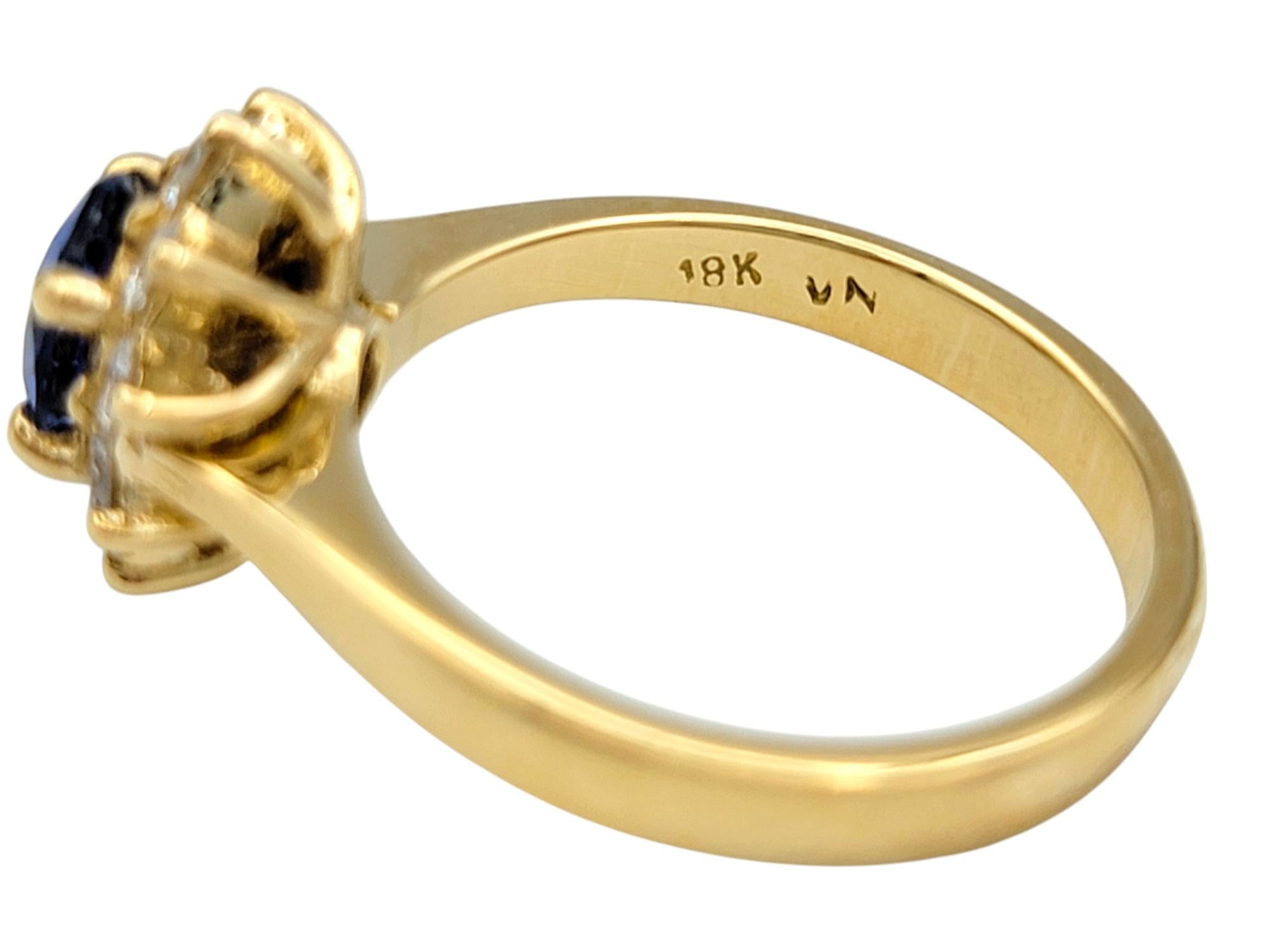 Women's Oval Cut Ceylon Sapphire and Diamond Halo Ring in Polished 18 Karat Yellow Gold For Sale