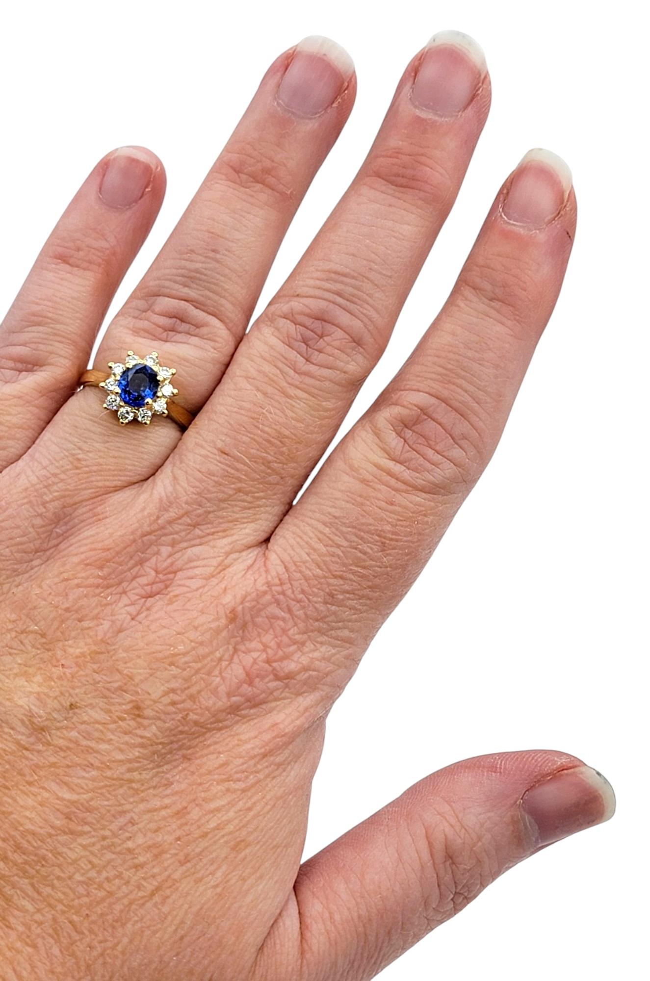 Oval Cut Ceylon Sapphire and Diamond Halo Ring in Polished 18 Karat Yellow Gold For Sale 1