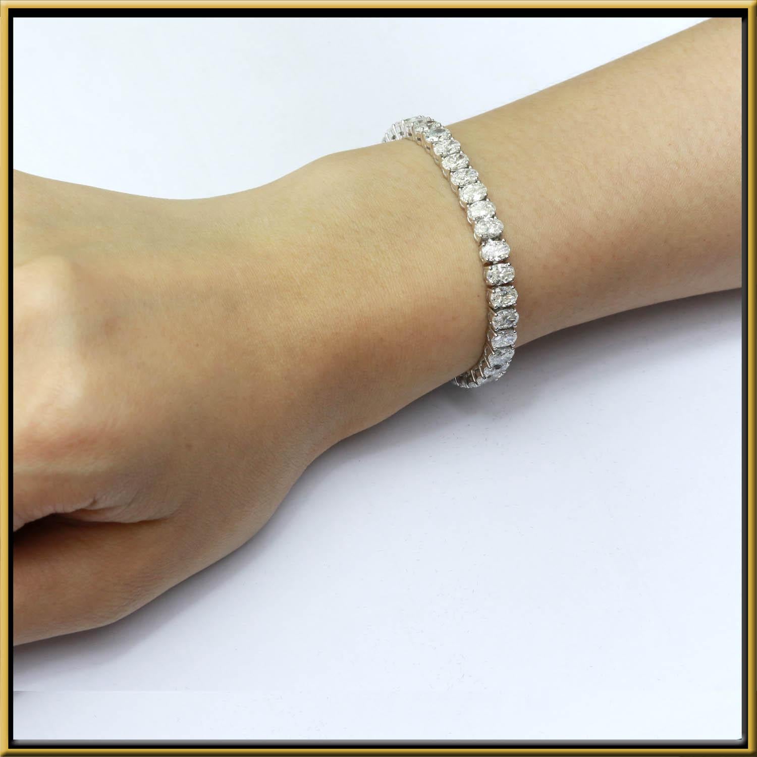 Tennis Bracelet with .30ct Oval Cut Diamonds set in 18k Gold. Total weight is approximately 14.3ct.
This is a classic statement bracelet that never goes out of style. 
It is lightweight yet durable, making it a perfect daily wear item.
The stone