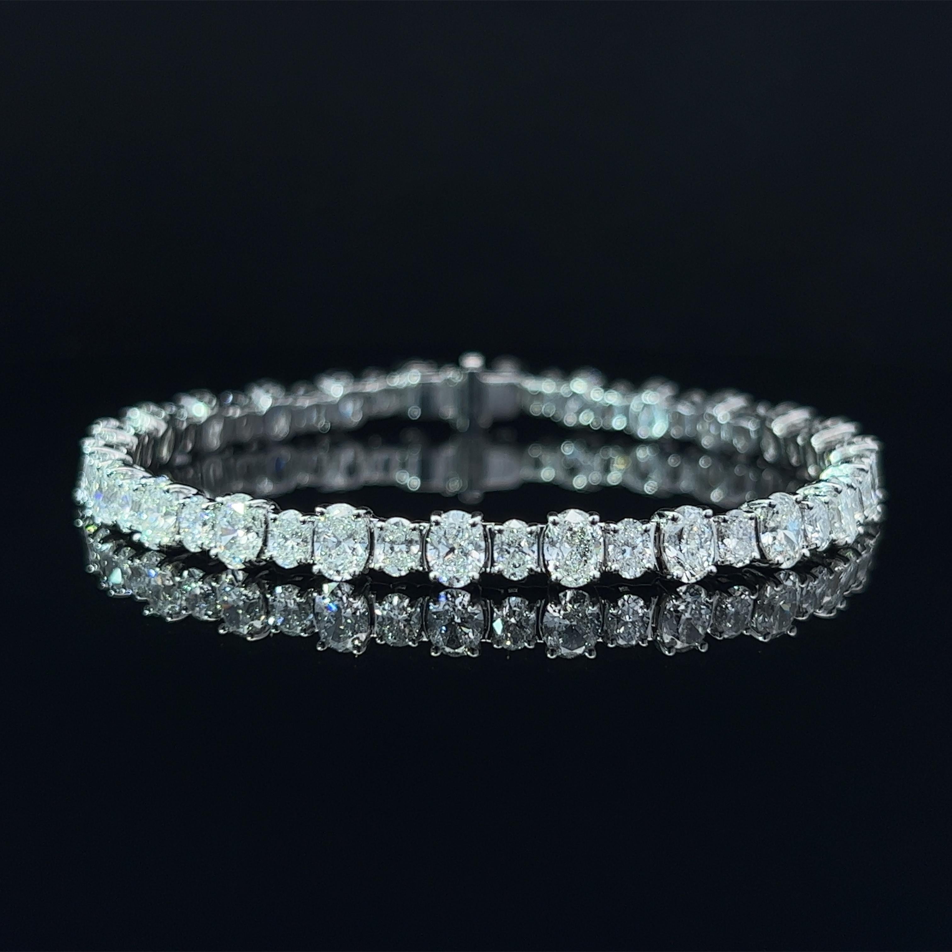 Diamond Shape: Oval
Total Diamond Weight: 10.64ct
Individual Diamond Weight: .33ct & .15ct
Color/Clarity: FG VVS 
Metal: 18K White Gold 
Metal Weight: 16.36g

Key Features:

Oval-Cut Diamonds: The centerpiece of this bracelet consists of two