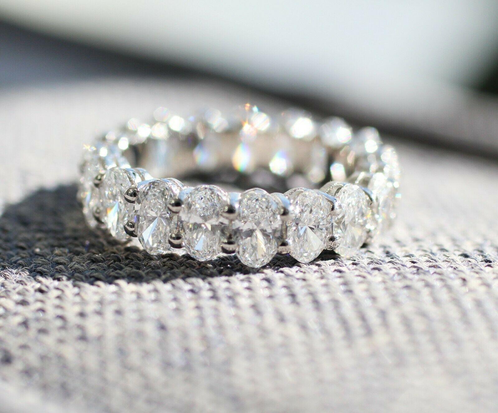  This is a stunning Oval eternity ring, features 19 pieces of oval cut diamonds in approximately 3.70 carat total weight, F color and VS2 stone clarity. This ring crafted in Platinum band. 
Specifications:
    main stone: OVAL CUT DIAMOND
   