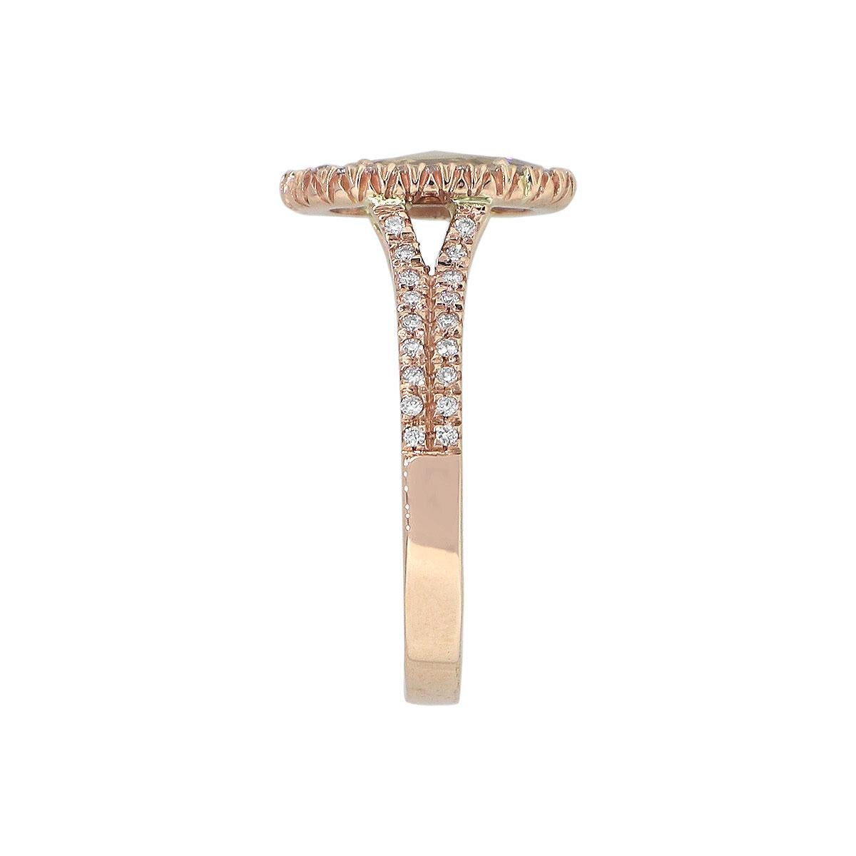Material: 14k Rose Gold
Center Diamond Details: Approx. 0.85ct Oval Cut Diamond. Diamond is Fancy Light Brown in color and SI in clarity
Adjacent Diamond Details: Approx. 0.50ctw of round cut diamonds. Diamonds are G/H in color and VS in