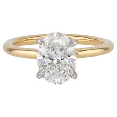 Verlobungsring mit ovalem Diamantschliff aus Platin und Gelbgold