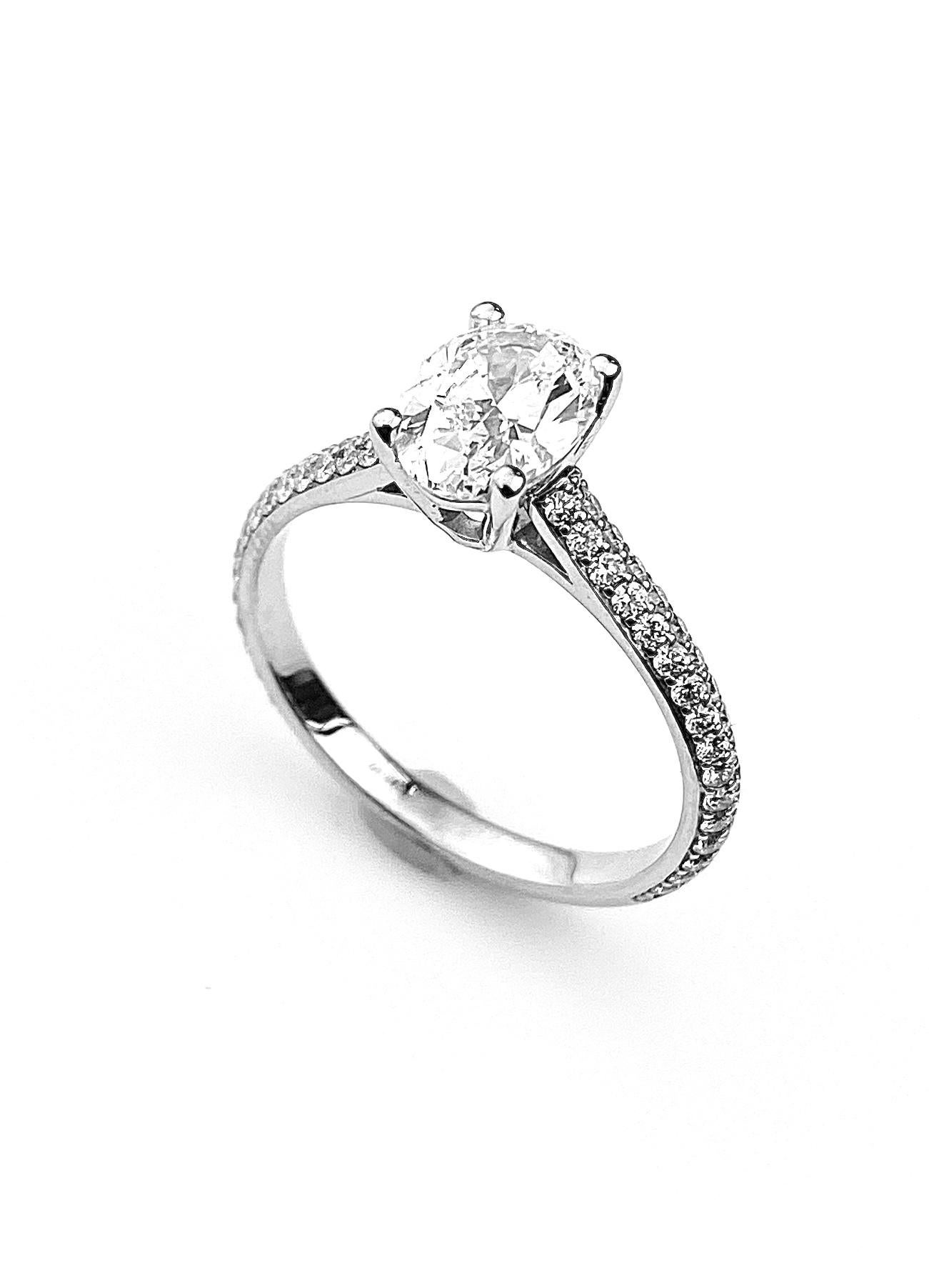 Oval Cut Diamond Solitaire Engagement Ring with Pavé Set Diamond Band In New Condition For Sale In Toronto, Ontario
