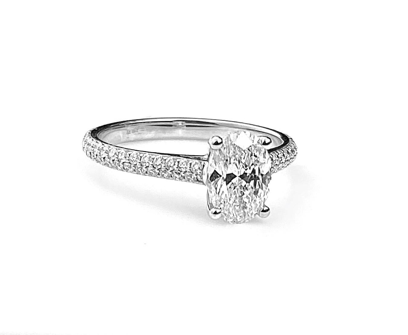 Oval Cut Diamond Solitaire Engagement Ring with Pavé Set Diamond Band For Sale 1